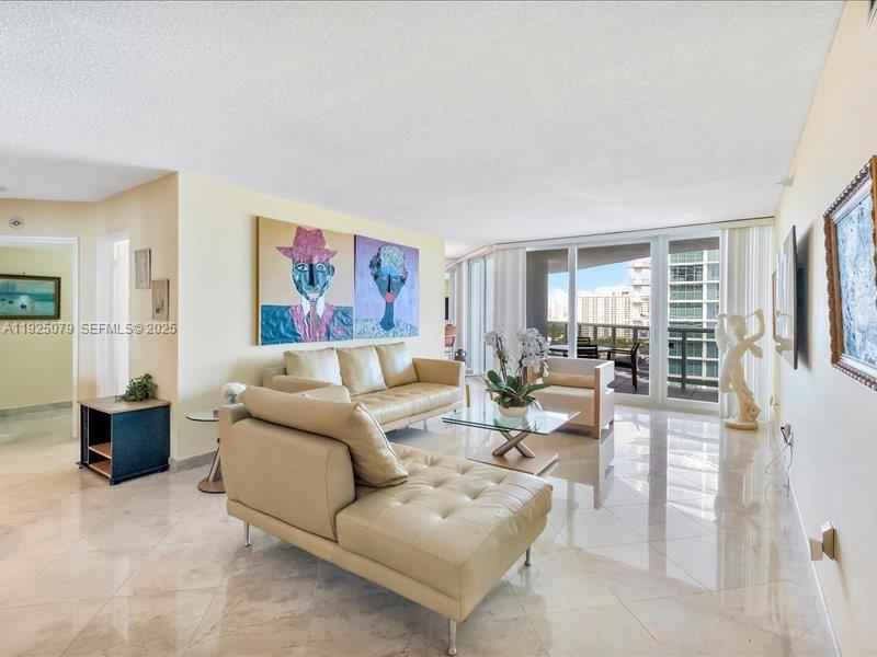 Photo of 16711 Collins Ave  #1604, Sunny Isles Beach, Florida, 33160 - Living room with views West, north and east