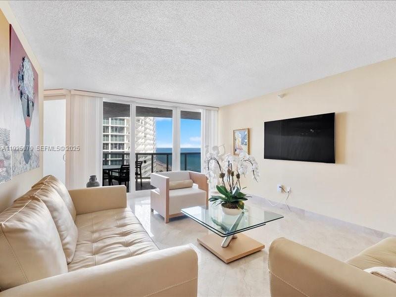 Photo of 16711 Collins Ave  #1604, Sunny Isles Beach, Florida, 33160 - Living room with views West, north and east