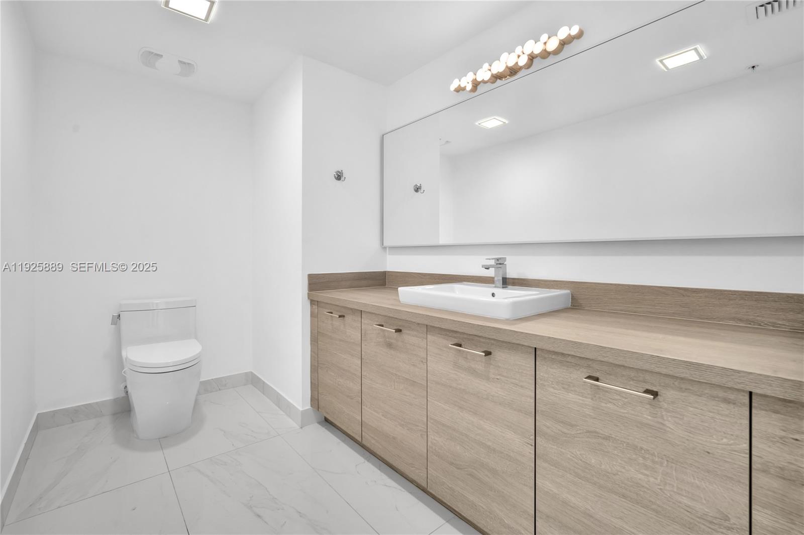 Photo of 400 Sunny Isles Blvd #1519, Sunny Isles Beach, Florida, 33160 - Third 1/2 Bathroom next to the kitchen