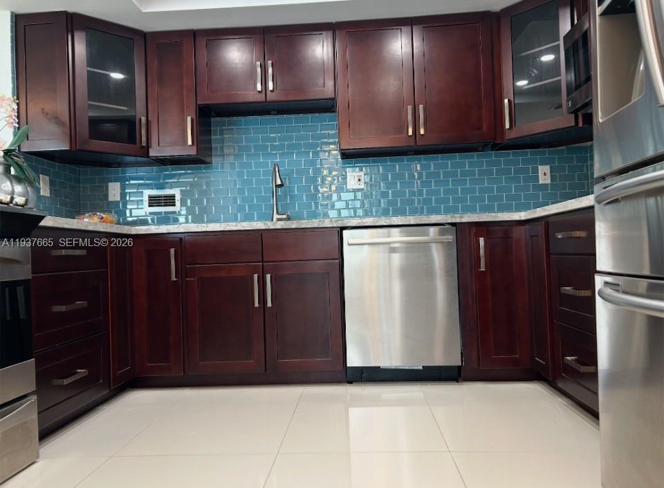 Photo of 2030 Ocean Dr  #506, Hallandale Beach, Florida, 33009 - cherry wood cabinets and porceline floors throughout