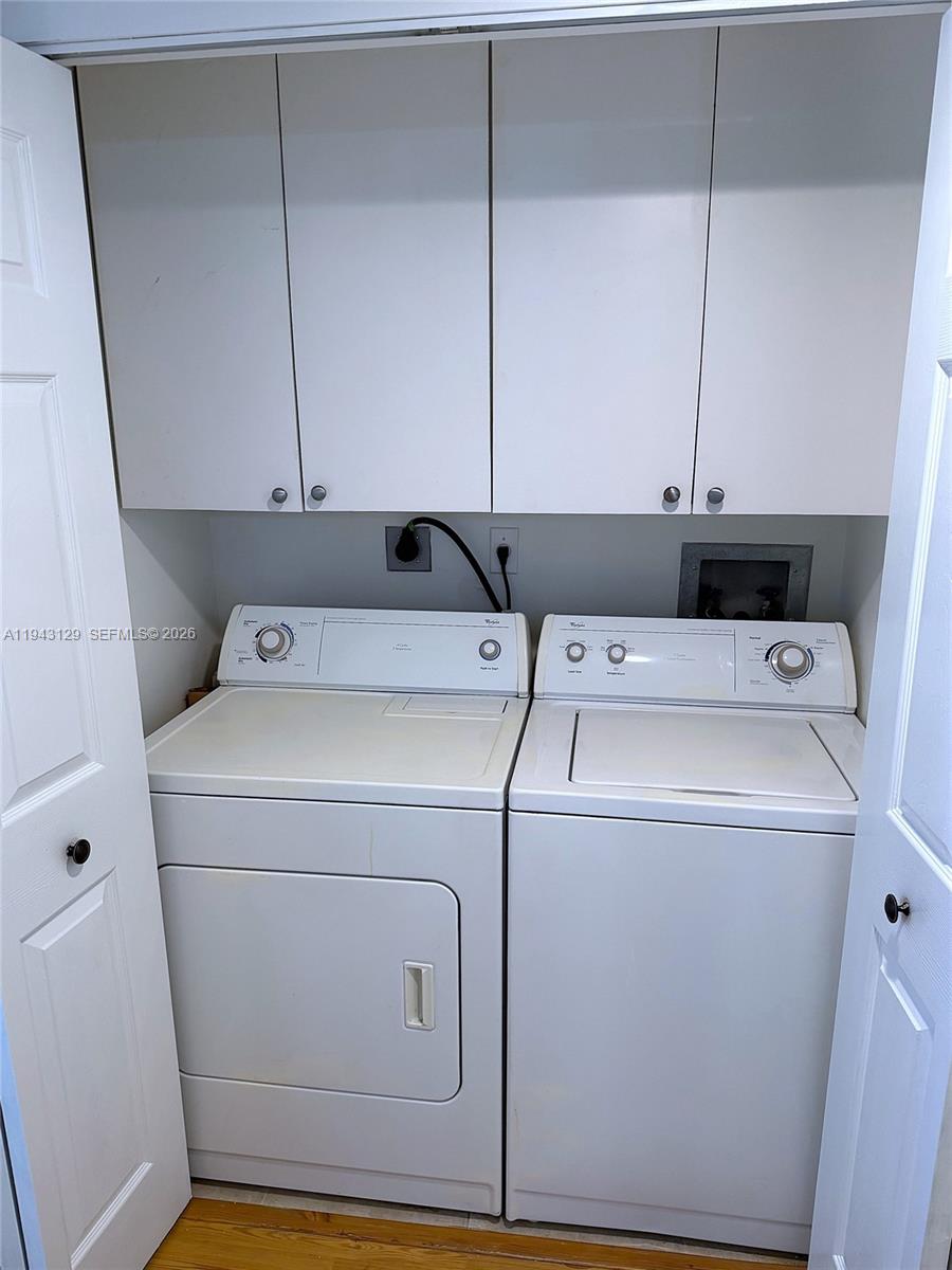 Photo of 2080 Ocean Dr #LPH05, Hallandale Beach, Florida, 33009 - Full size washer and dryer with cabinets