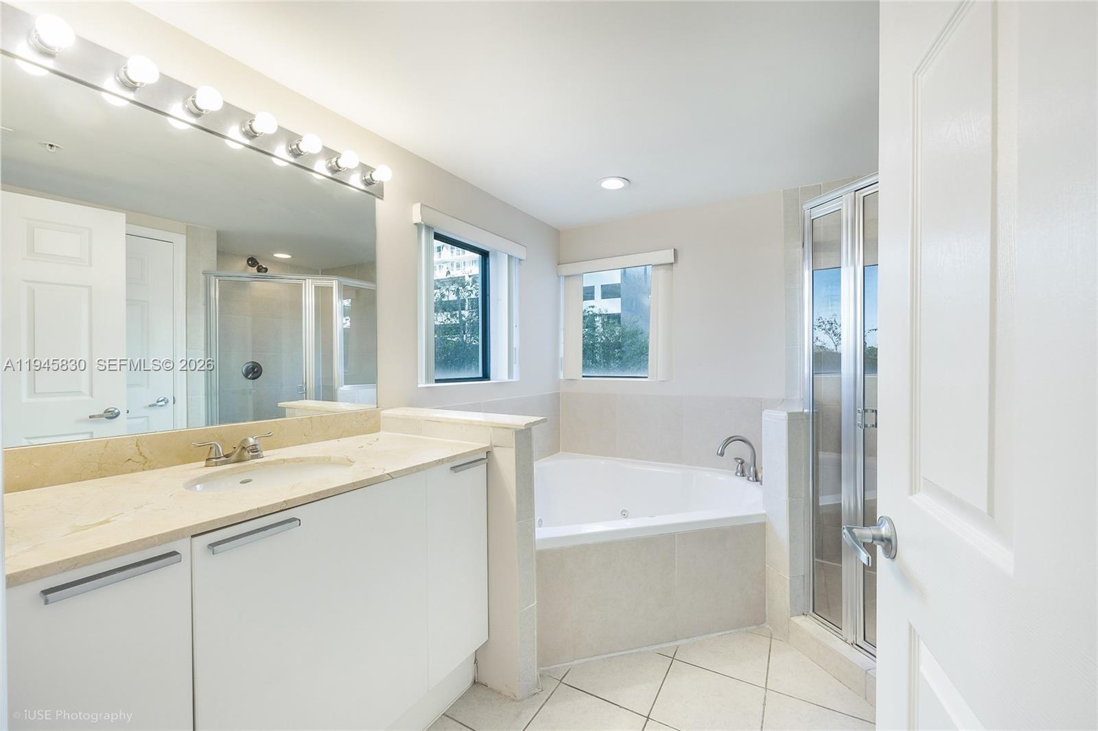 Photo of 140 Dixie Hwy  #TH101, Hollywood, Florida, 33020 - Master bathroom with windows and plenty of light