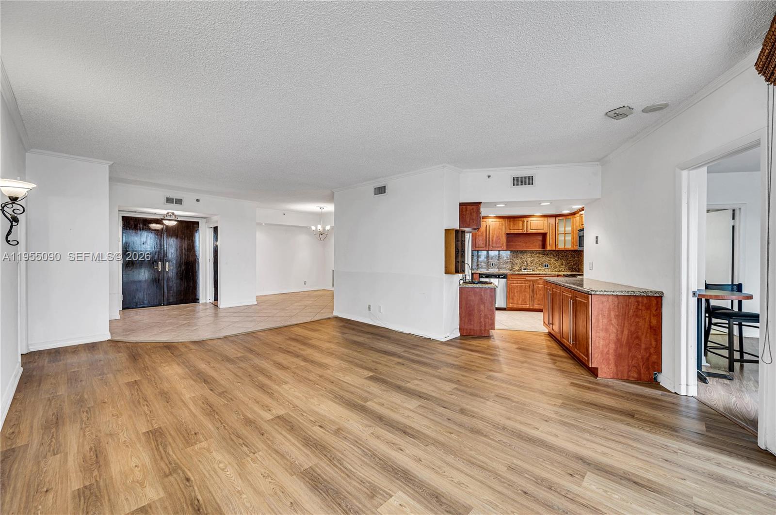 Photo of 20281 Country Club Dr  #210, Aventura, Florida, 33180 - Living room, kitchen and entry