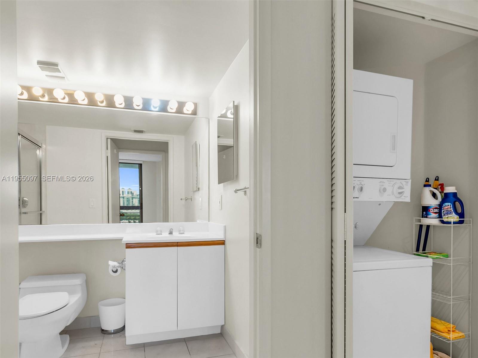 Photo of 3400 192nd St  #910, Aventura, Florida, 33180 - Guest bathroom and laundry