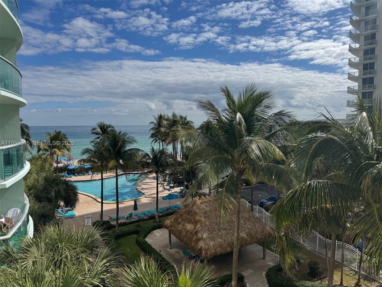 Photo of 3901 Ocean Dr #4J, Hollywood, Florida, 33019 - Actual view from the unit, facing SE, ocean & pool.