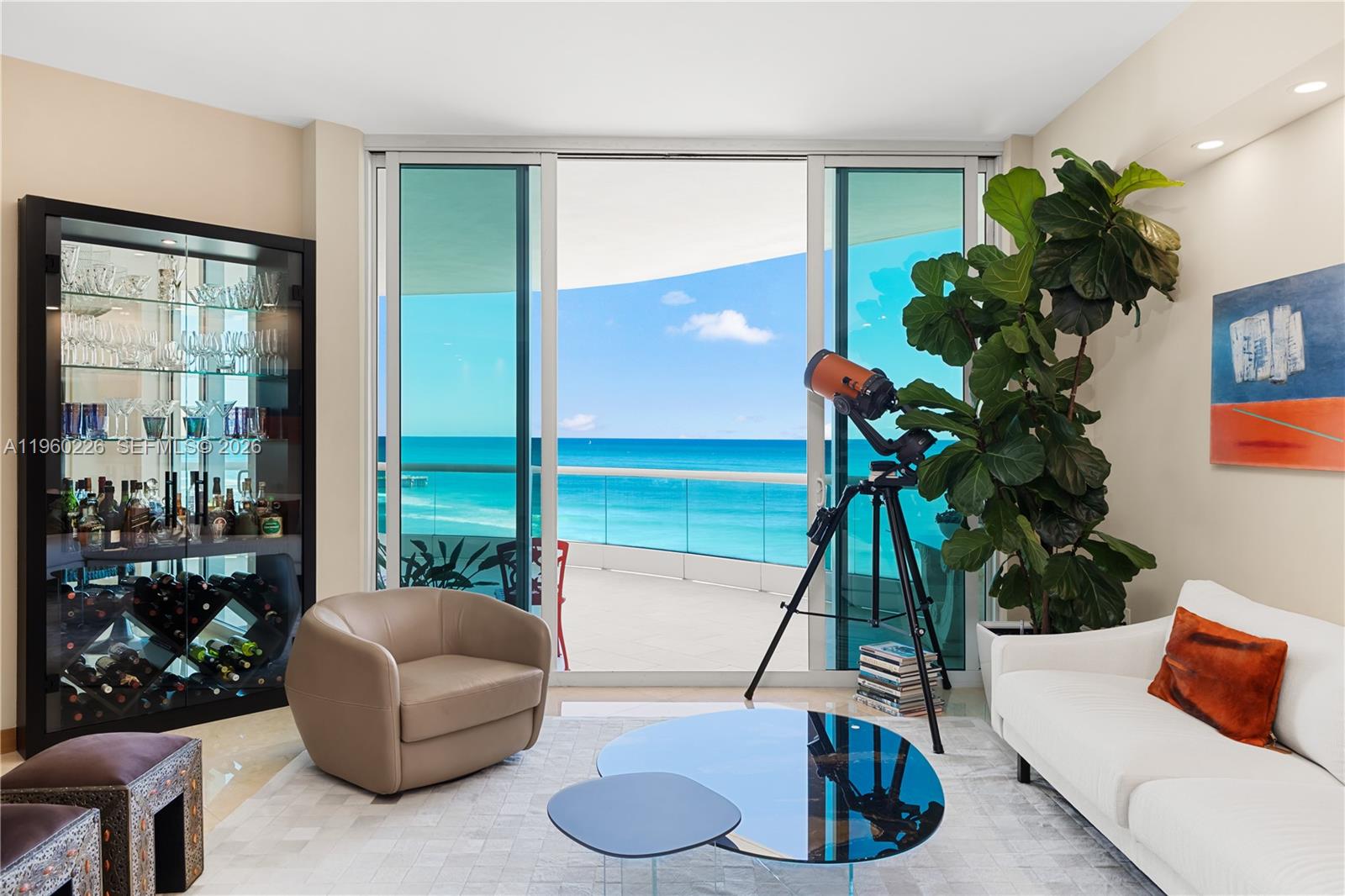 Photo of 16047 Collins Ave  #1001, Sunny Isles Beach, Florida, 33160 - Custom glass wine cabinet and bar.