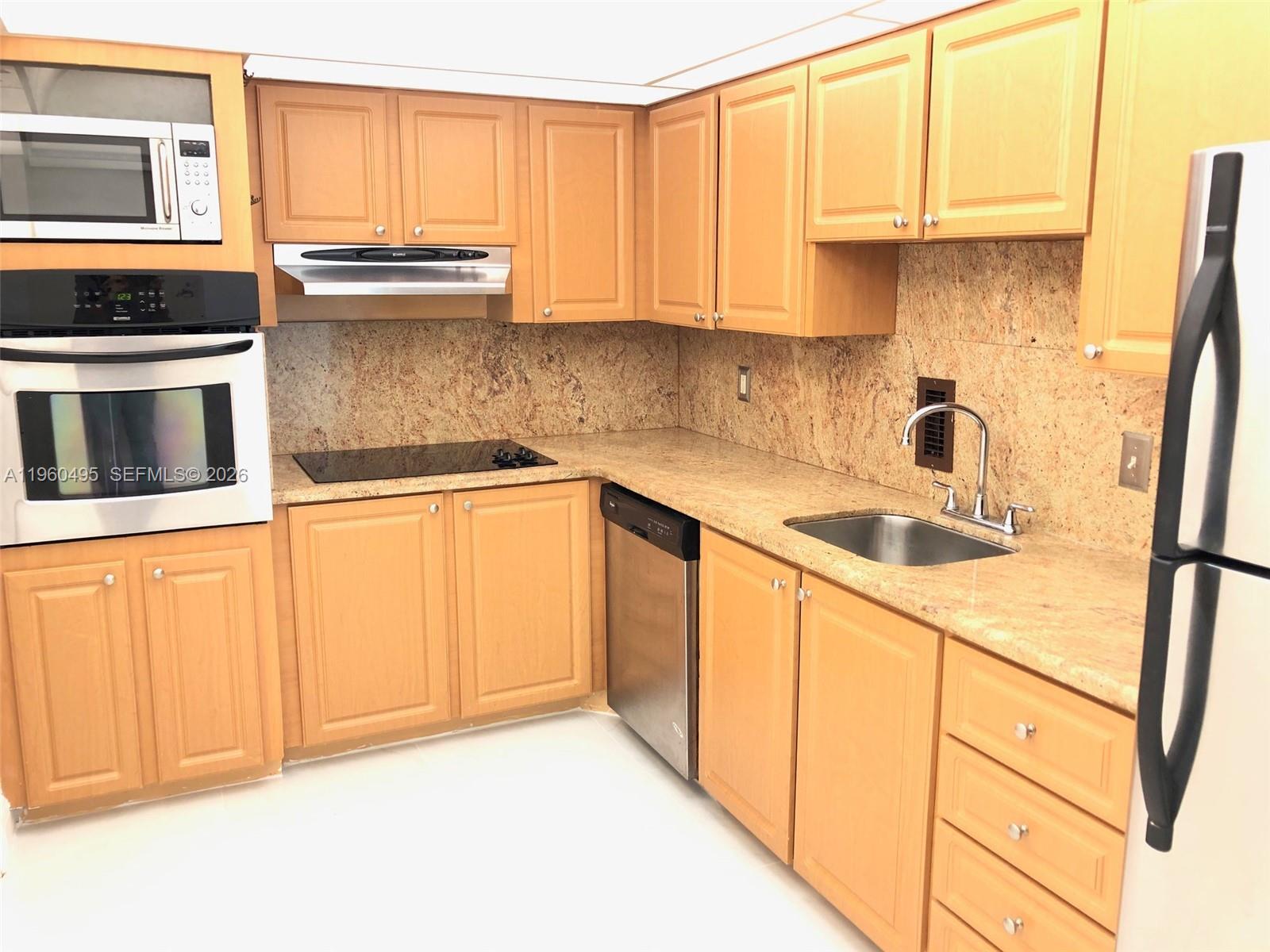 Photo of 3901 Ocean Dr  #2J, Hollywood, Florida, 33019 - Kitchen with granite counters