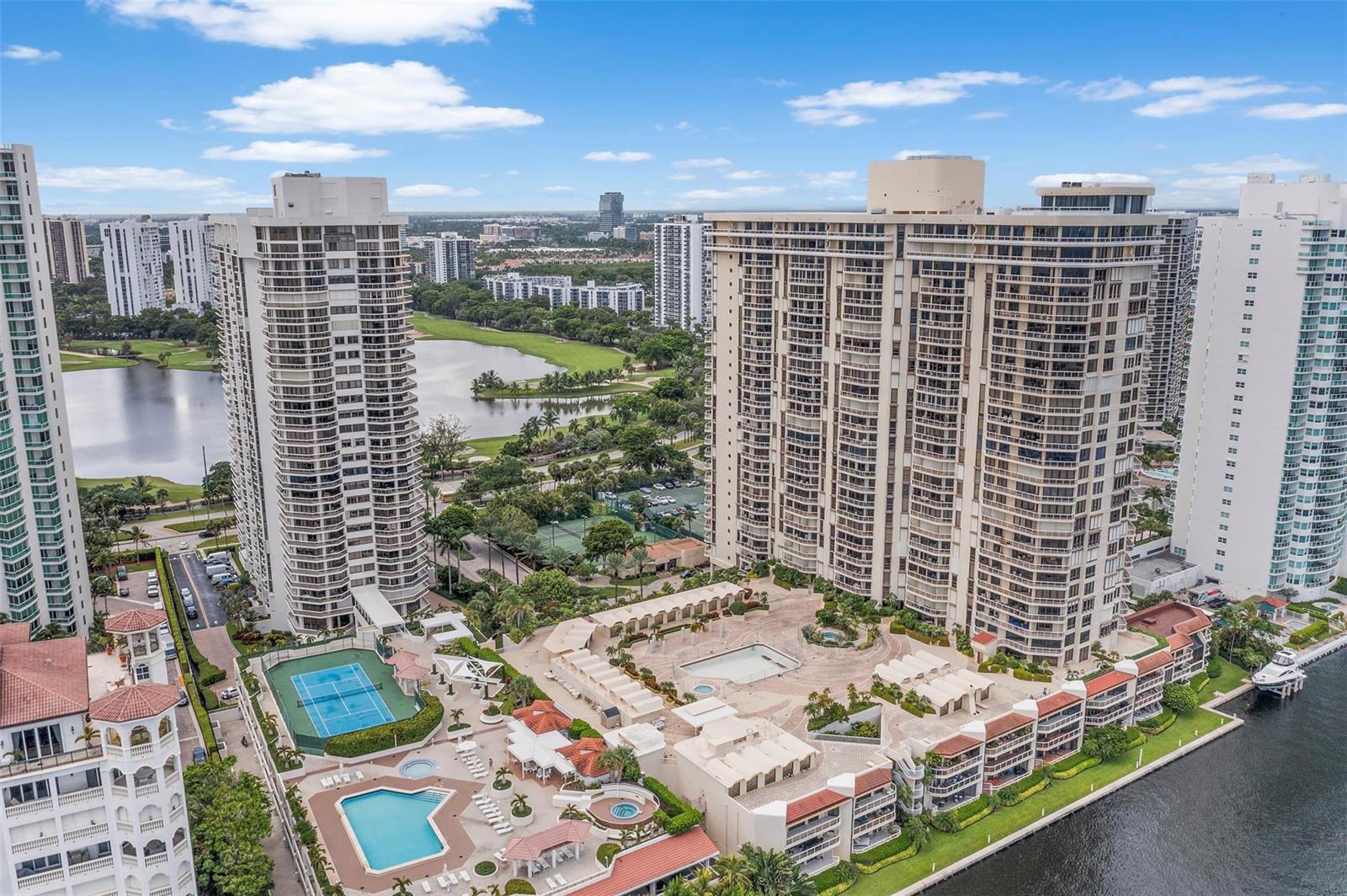 Photo of 20185 Country Club  #901, Aventura, Florida, 33180 - Drone views looking West of the Building