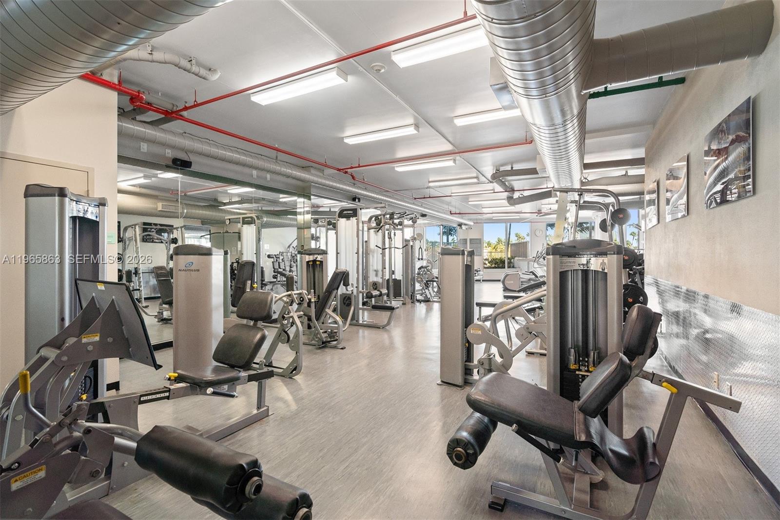 Photo of 3029 188th St #1019, Aventura, Florida, 33180 - Spacious Fitness Center overlooking Pool Deck