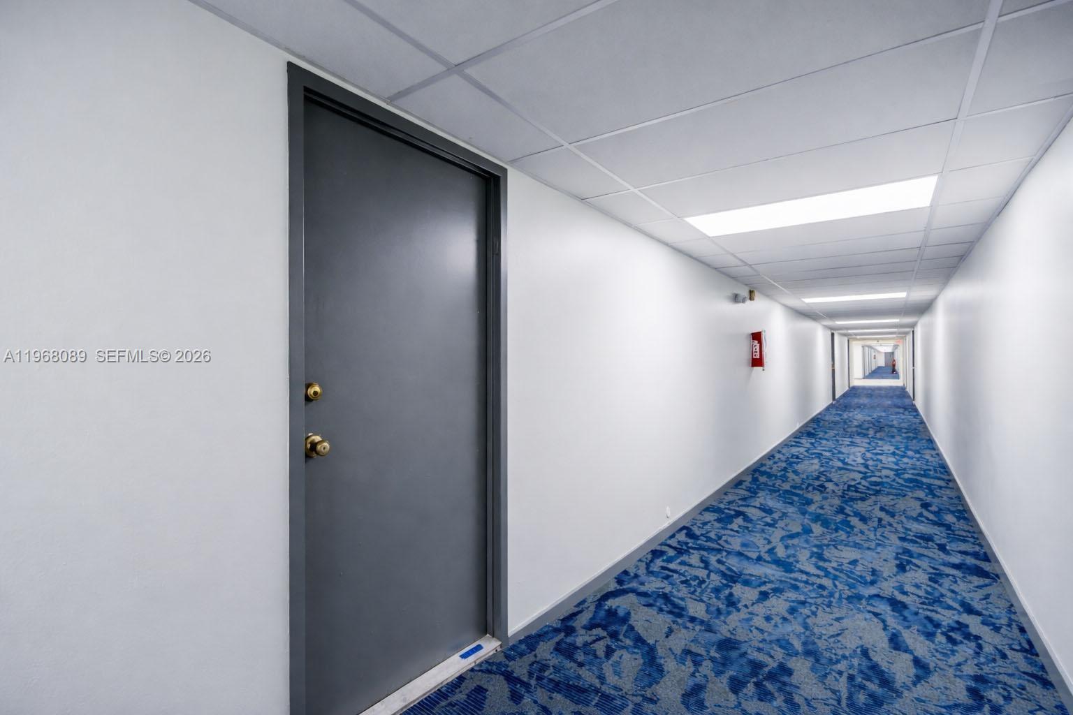 Photo of 801 Three Islands Blvd #111, Hallandale Beach, Florida, 33009 - Hallway from the Lobby