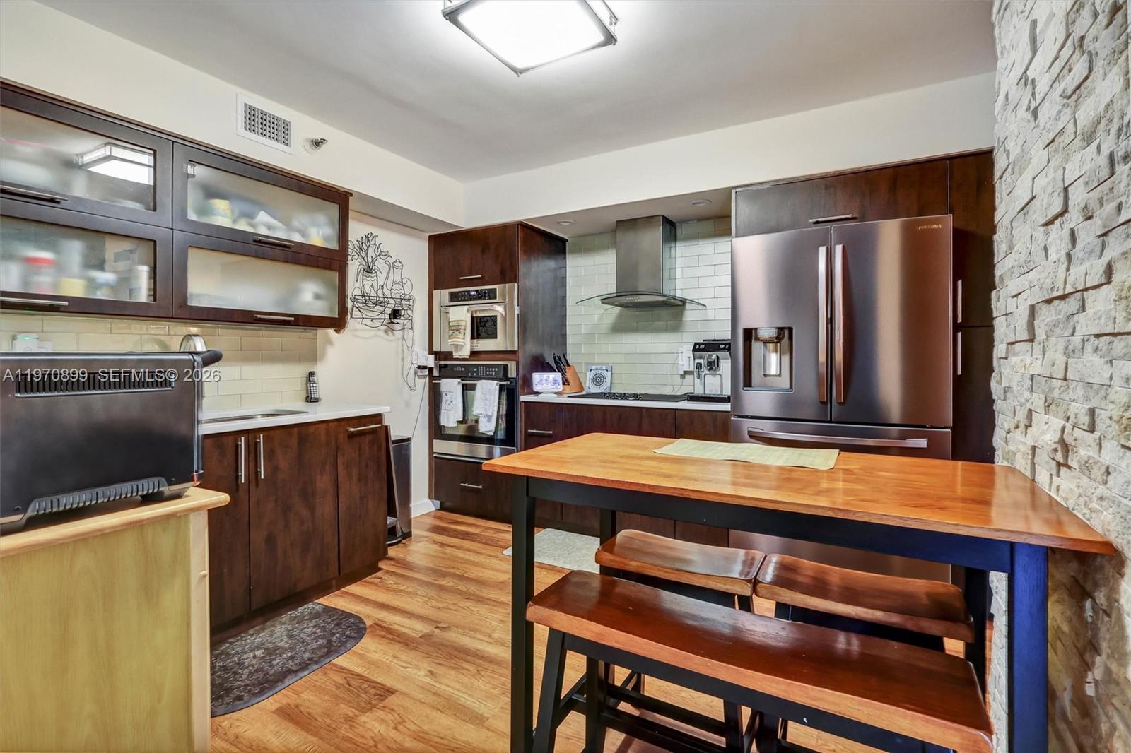 Photo of 3500 Mystic Pointe Dr  #302, Aventura, Florida, 33180 - Functional and well-designed with an eat-in area, ideal for casual dining and everyday convenience.