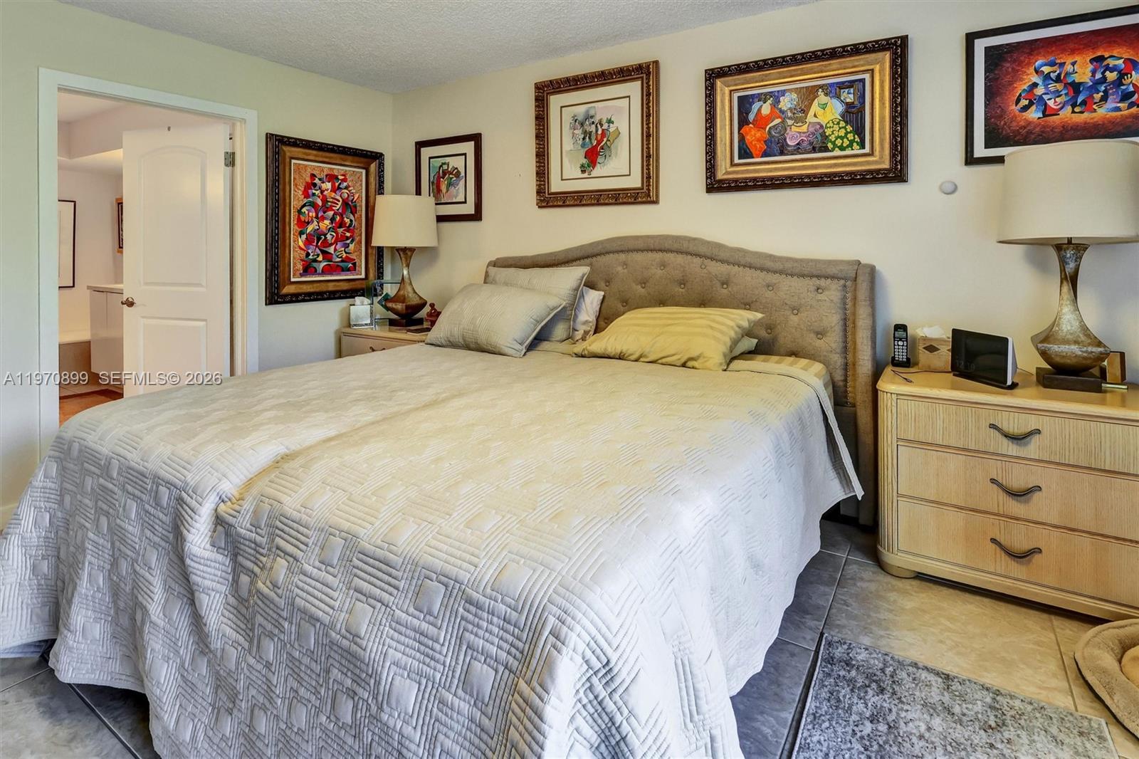 Photo of 3500 Mystic Pointe Dr  #302, Aventura, Florida, 33180 - Generously sized retreat with a large walk-in closet and sleek electric blinds for added comfort and privacy.