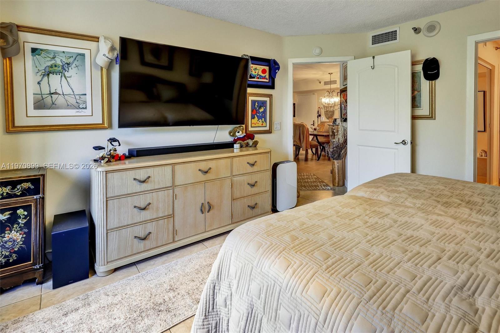 Photo of 3500 Mystic Pointe Dr  #302, Aventura, Florida, 33180 - Generously sized retreat with a large walk-in closet and sleek electric blinds for added comfort and privacy.