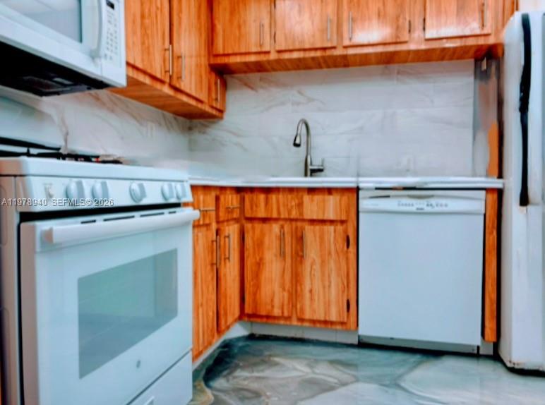 Photo of 2030 Ocean Dr  #1802, Hallandale Beach, Florida, 33009 - KITCHEN FEATURING NATURAL GAS OVEN ,DISHWASHER, REFRIGERATOR, FOOD DISPOSAL, MICROWAVE