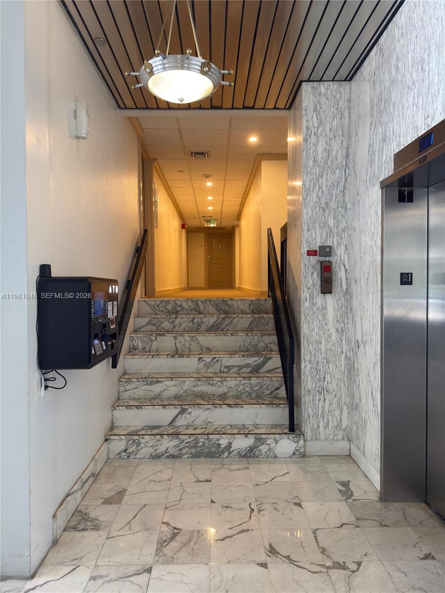 Photo of 3675 Country Club Dr  #109, Aventura, Florida, 33180 - Stairs goes to unit from lobby