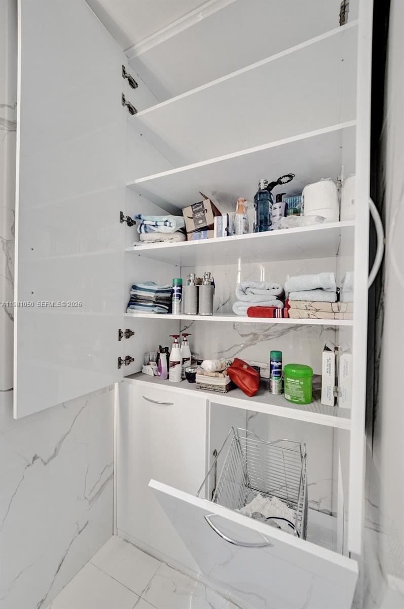 Photo of 20281 Country Club Dr  #2209, Aventura, Florida, 33180 - Extra storage in the bathroom.