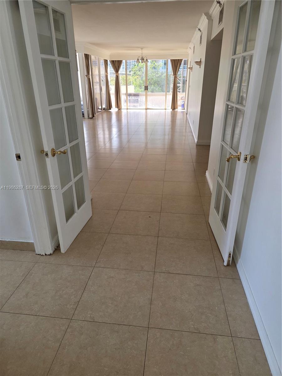 Photo of 19355 Turnberry Way  #2E, Aventura, Florida, 33180 - living area/doors lead to primary bedroom