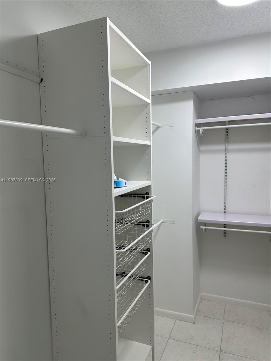 Photo of 600 Three Islands Blvd  #1113, Hallandale Beach, Florida, 33009 - Walk in Closet with French Organizer