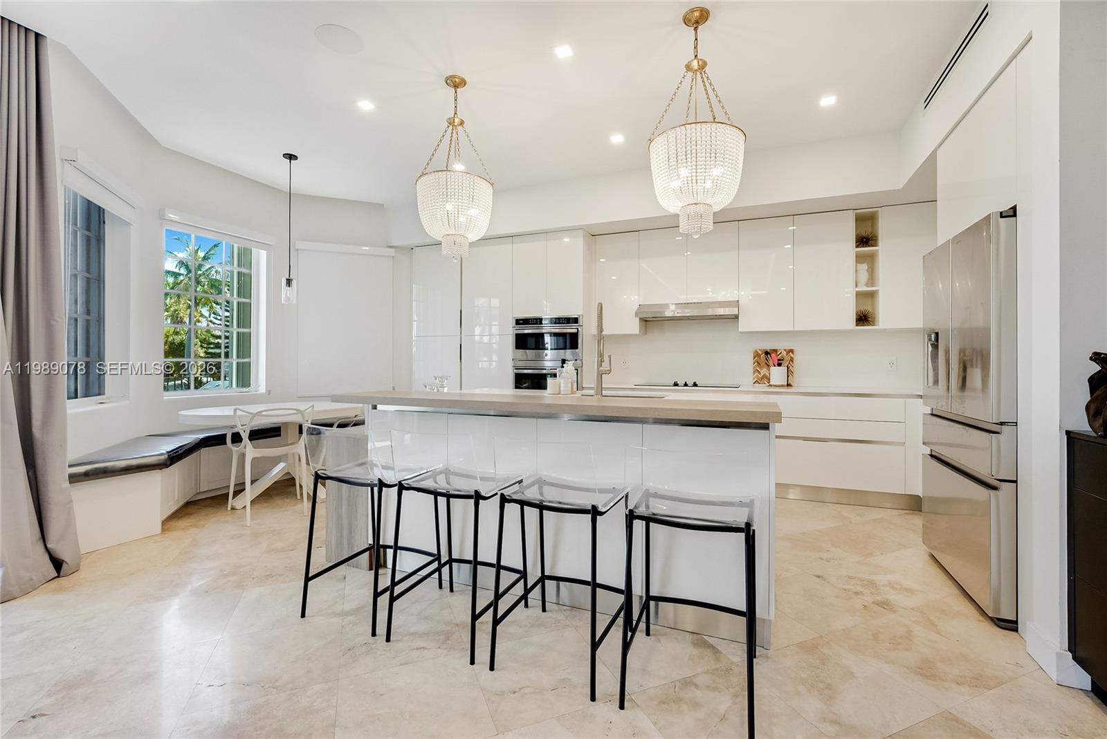 Photo of 20765 32nd Ave  (20765), Aventura, Florida, 33180 - Modern kitchen natural light flooded open concept and high ceilings with quartz counter tops in private gated Aventura Lakes