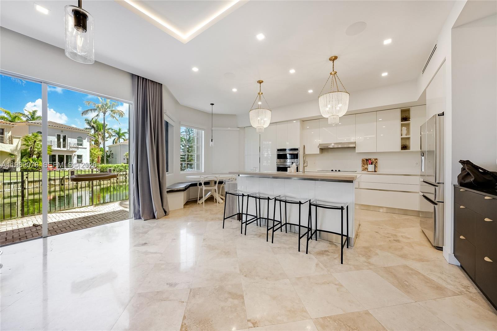 Photo of 20765 32nd Ave  (20765), Aventura, Florida, 33180 - Modern kitchen with quartz counter tops in open concept Aventura Lakes