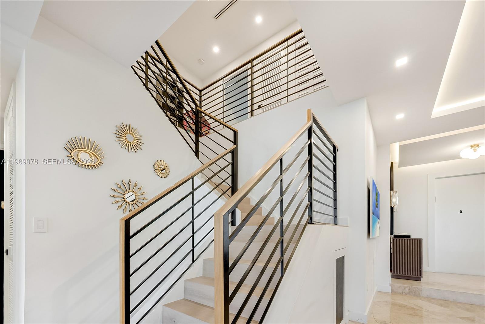 Photo of 20765 32nd Ave  (20765), Aventura, Florida, 33180 - Updated Aventura Lakes home adorned with updated staircase railing for modern feel