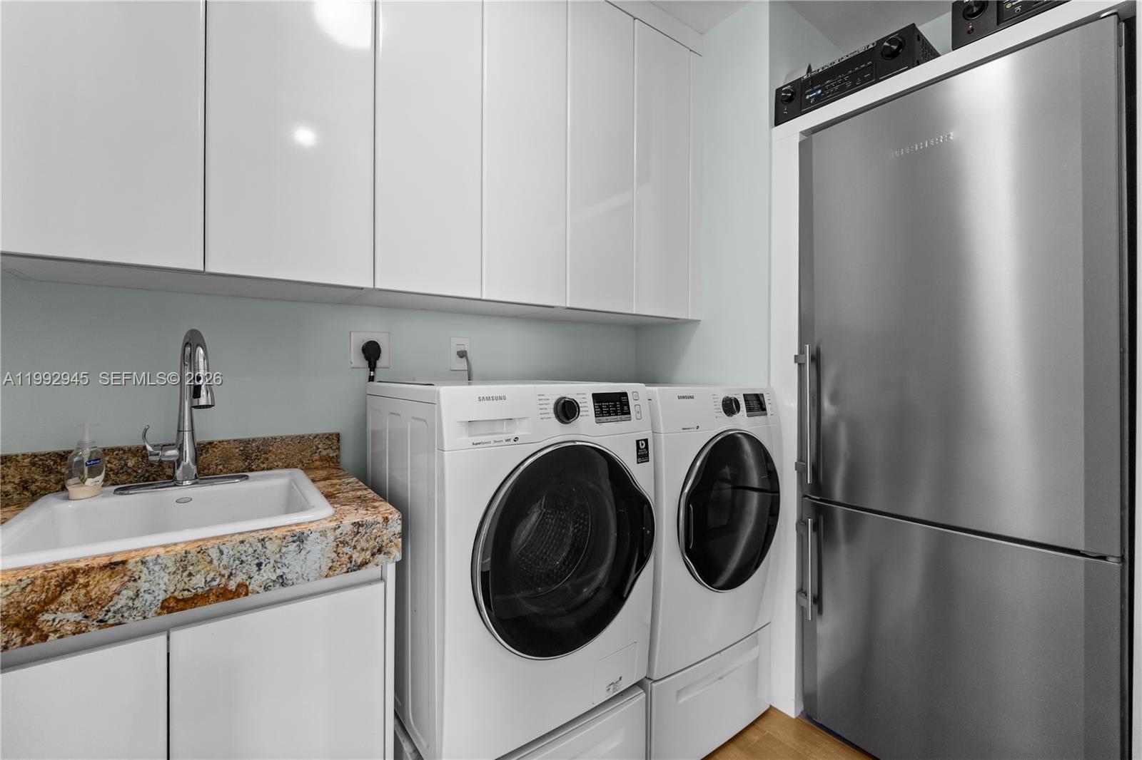 Photo of 9703 Collins Ave  #600, Bal Harbour, Florida, 33154 - Laundry room with a sink and an extra refrigerator!