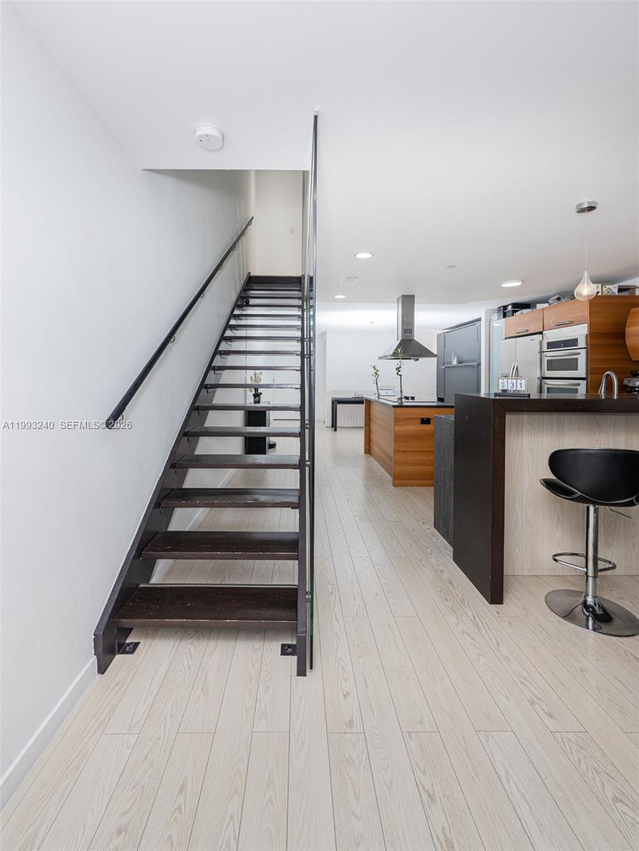 Photo of 2950 188th St  #139, Aventura, Florida, 33180 - Stairs to the second level of the unit.