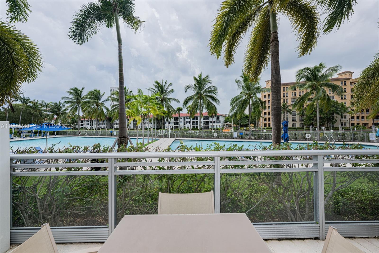 Photo of 2950 188th St  #139, Aventura, Florida, 33180 - Living Room/w Balcony overviewing the Pool