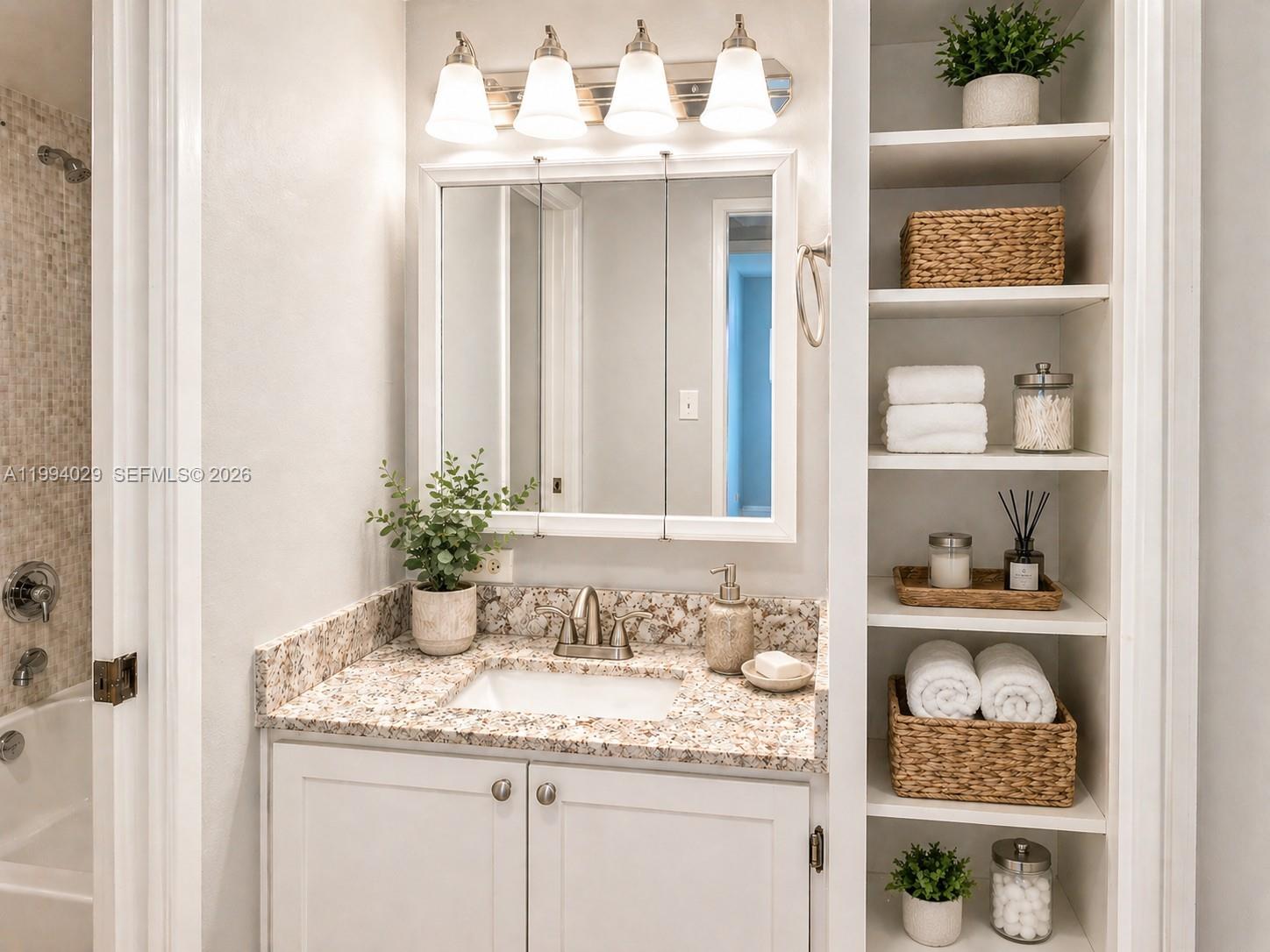 Photo of 17011 Bay Rd  #503, Sunny Isles Beach, Florida, 33160 - Bathroom storage styled