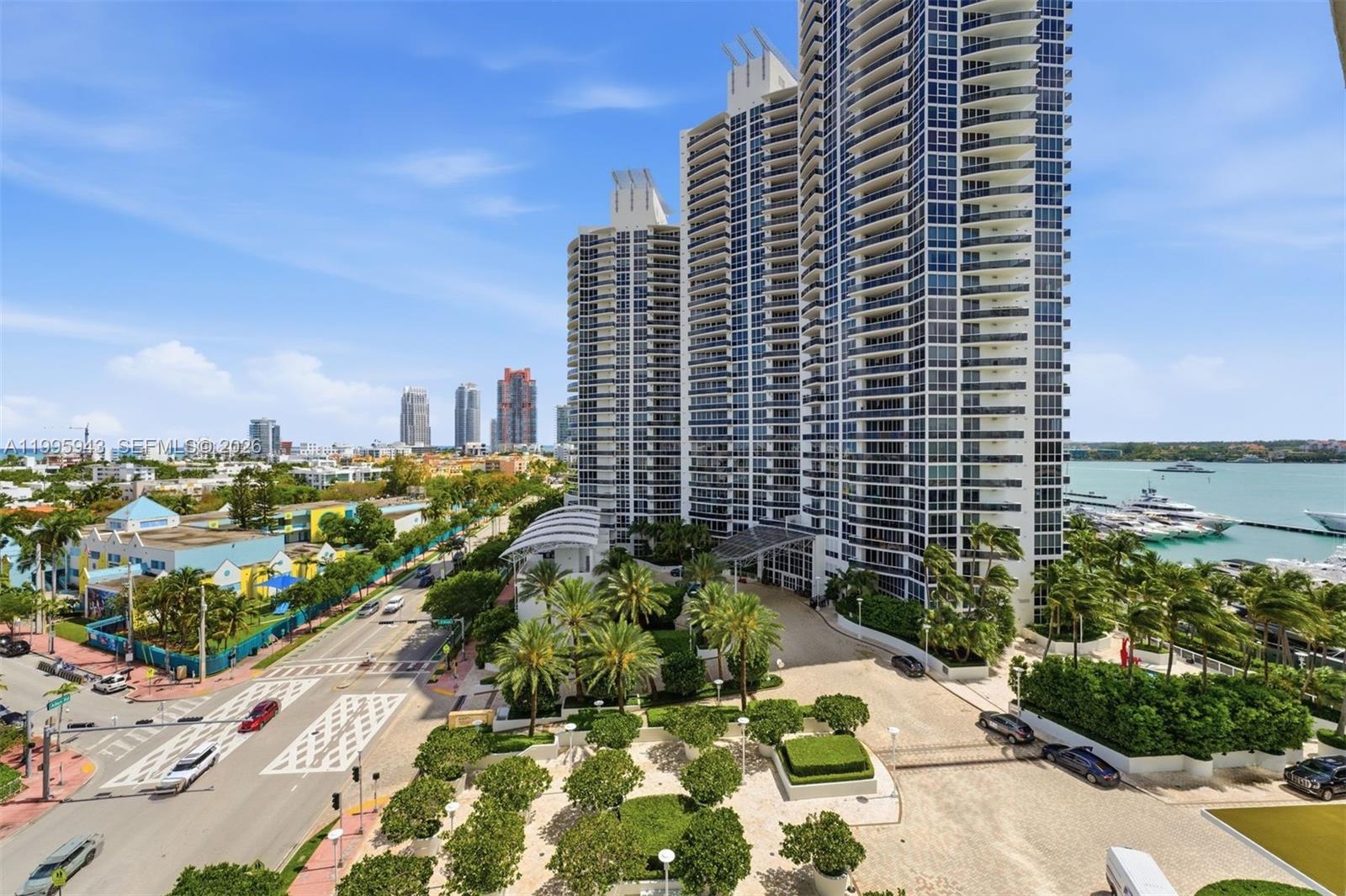 Photo of 450 Alton Rd  #910, Miami Beach, Florida, 33139 - View from balcony- South. Bay, marina, South Pointe, ocean, and city views.