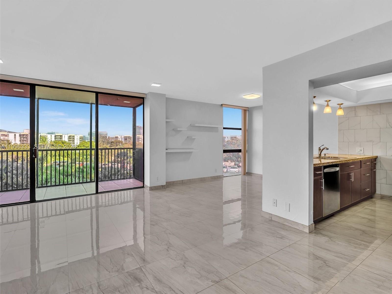 Photo of #521, Aventura, Florida, 33180 - Open living area with balcony view and kitchen access