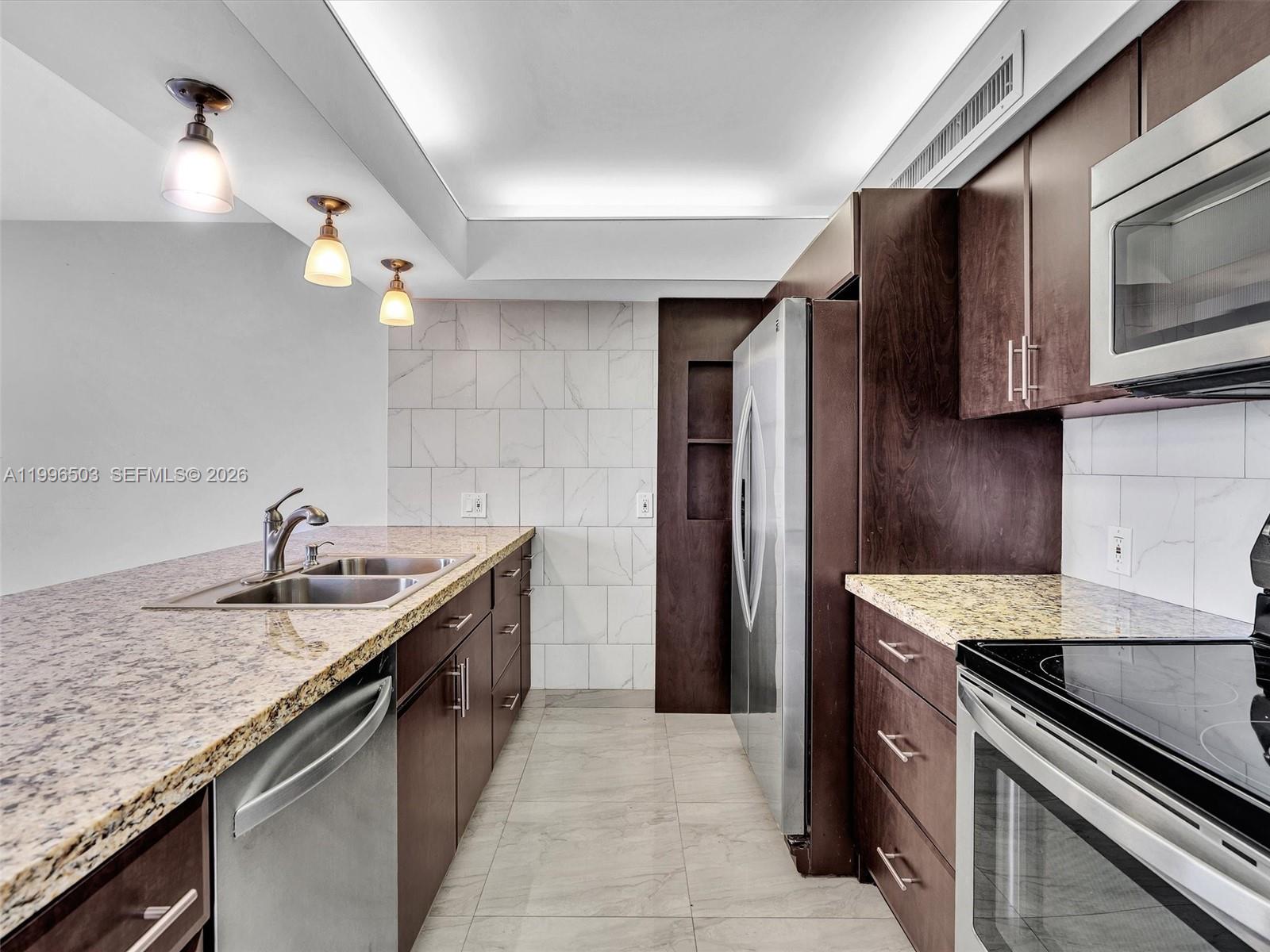 Photo of #521, Aventura, Florida, 33180 - Updated Kitchen with granite counterops and stainless steel appliances