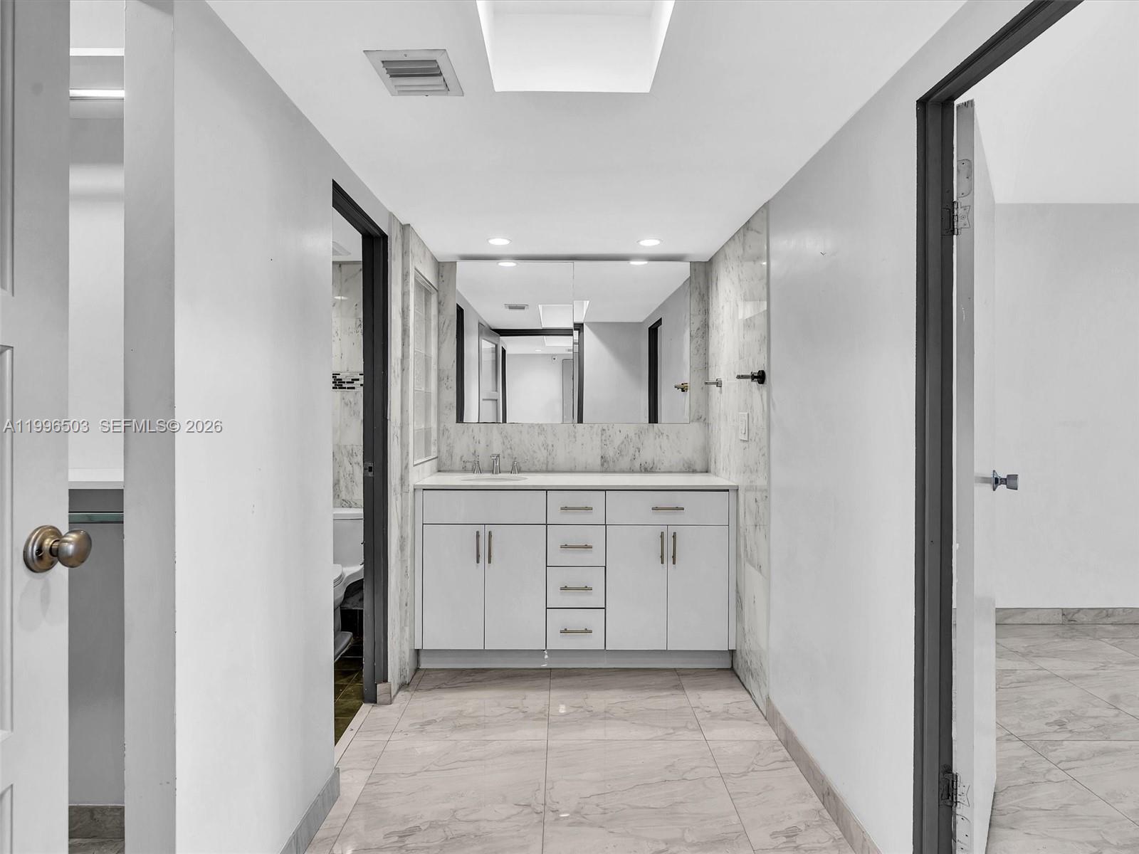 Photo of #521, Aventura, Florida, 33180 - Entry to private bedroom suite with bedroom to the right and bathroom area