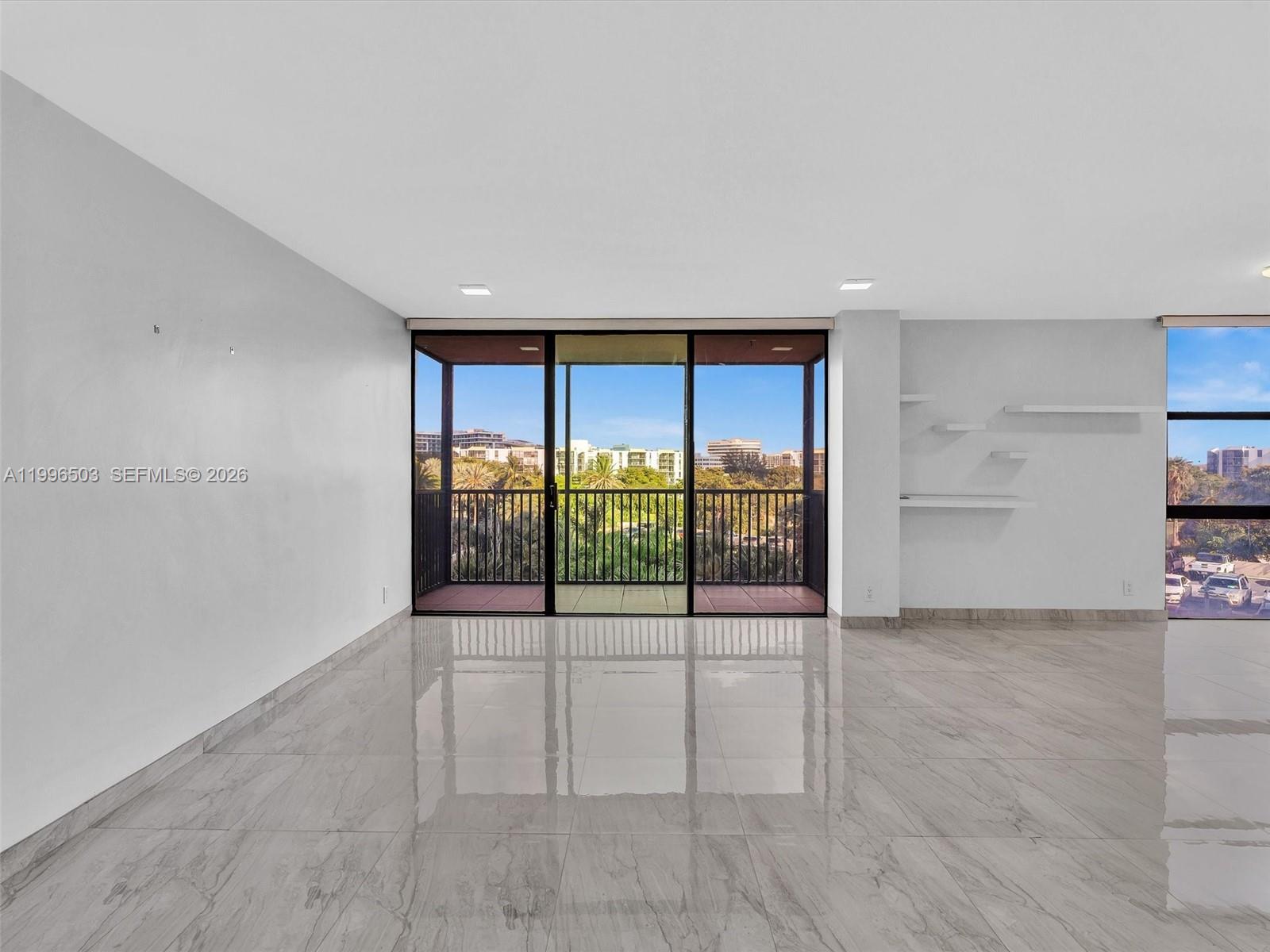 Photo of #521, Aventura, Florida, 33180 - Spacious living area with natural light and balcony view