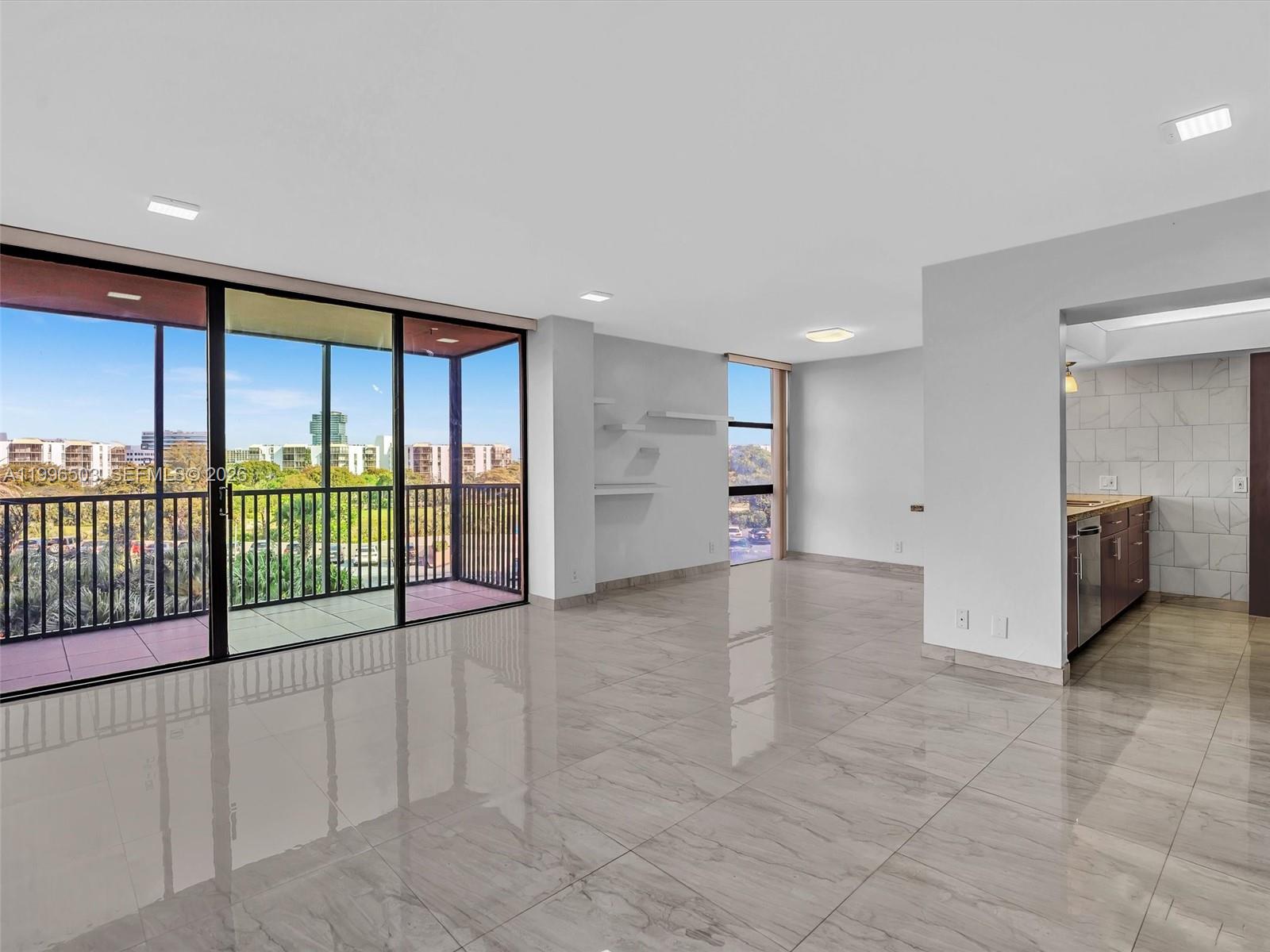 Photo of #521, Aventura, Florida, 33180 - Spacious living area with extended open layout and balcony view