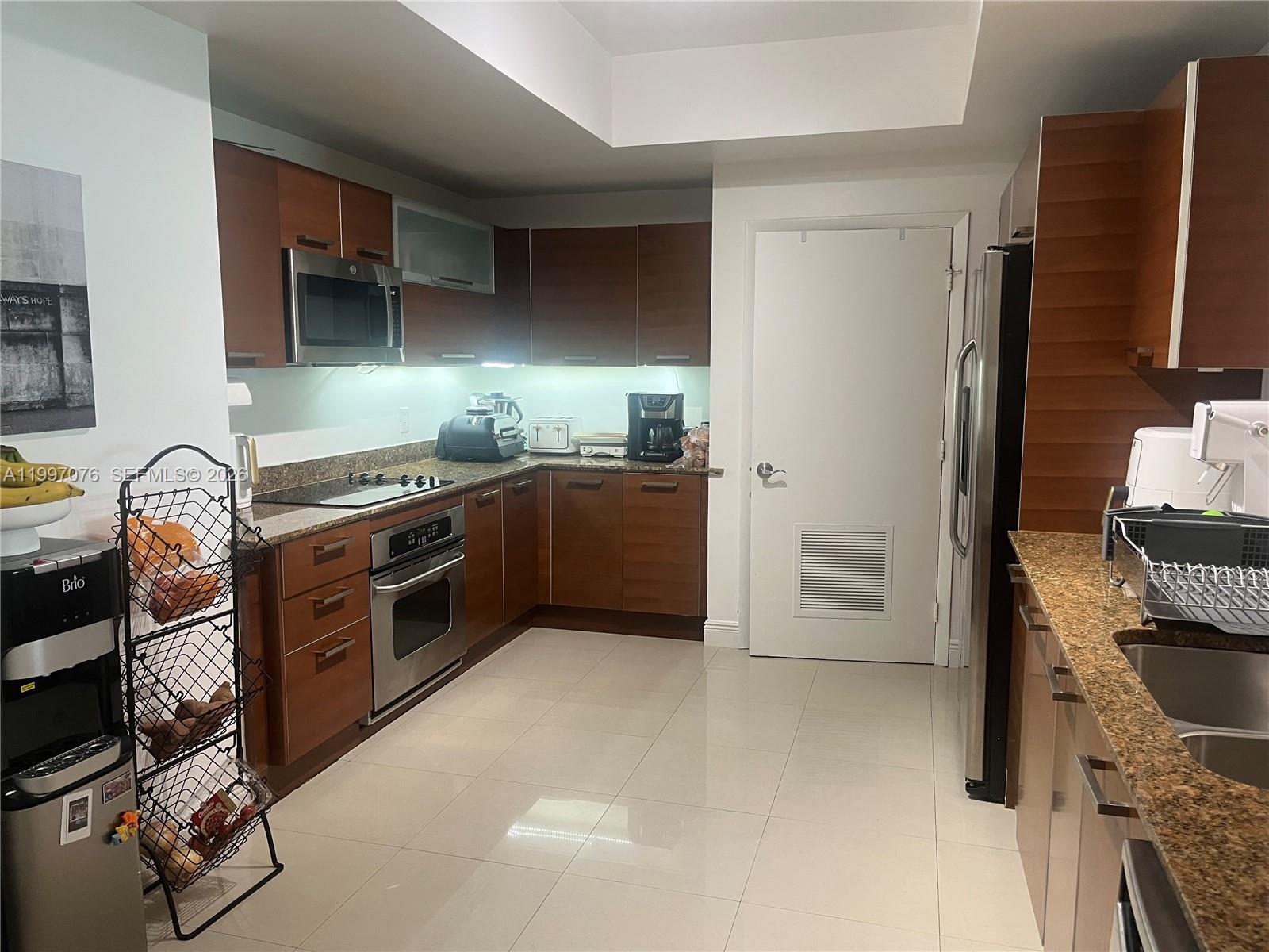 Photo of 3330 190th St  #1615, Aventura, Florida, 33180 - Large Italian style kitchen with laundry room