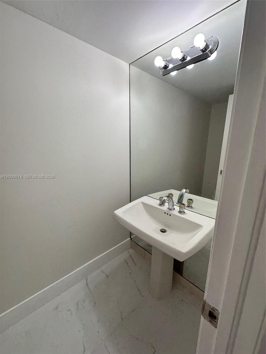 Photo of 8925 Collins Ave  #2J, Surfside, Florida, 33154 - Half bathroom