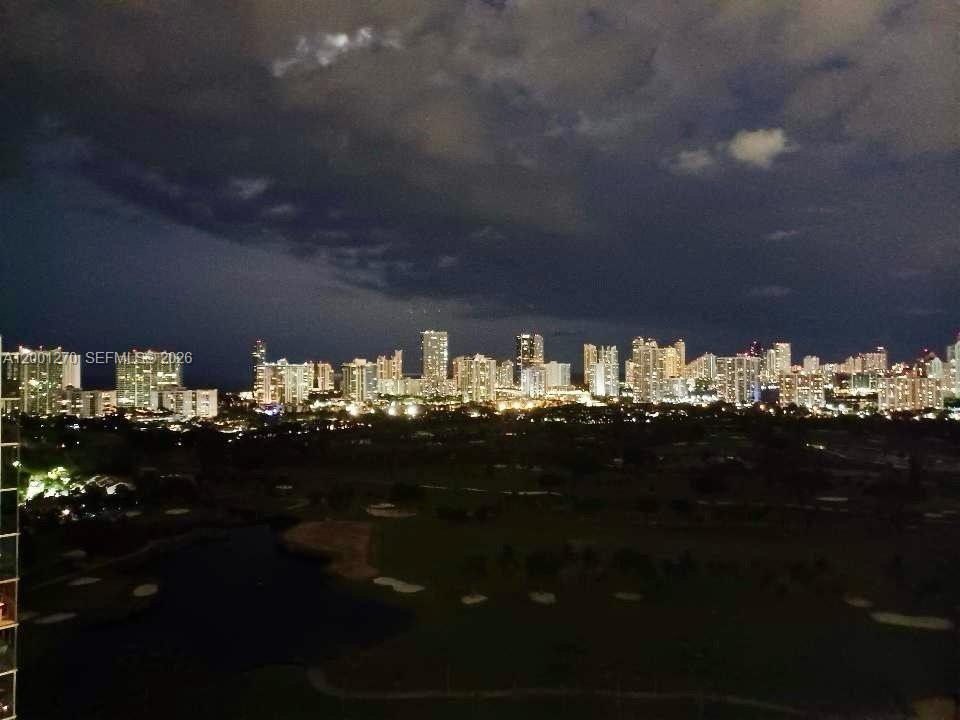 Photo of 20301 Country Club Dr  #PH24, Aventura, Florida, 33180 - Stunning nighttime skyline views from a penthouse-level residence.
