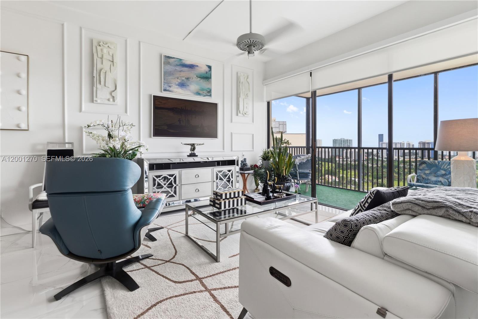 Photo of 20301 Country Club Dr  #PH24, Aventura, Florida, 33180 - Bright living area with high ceilings and skyline views