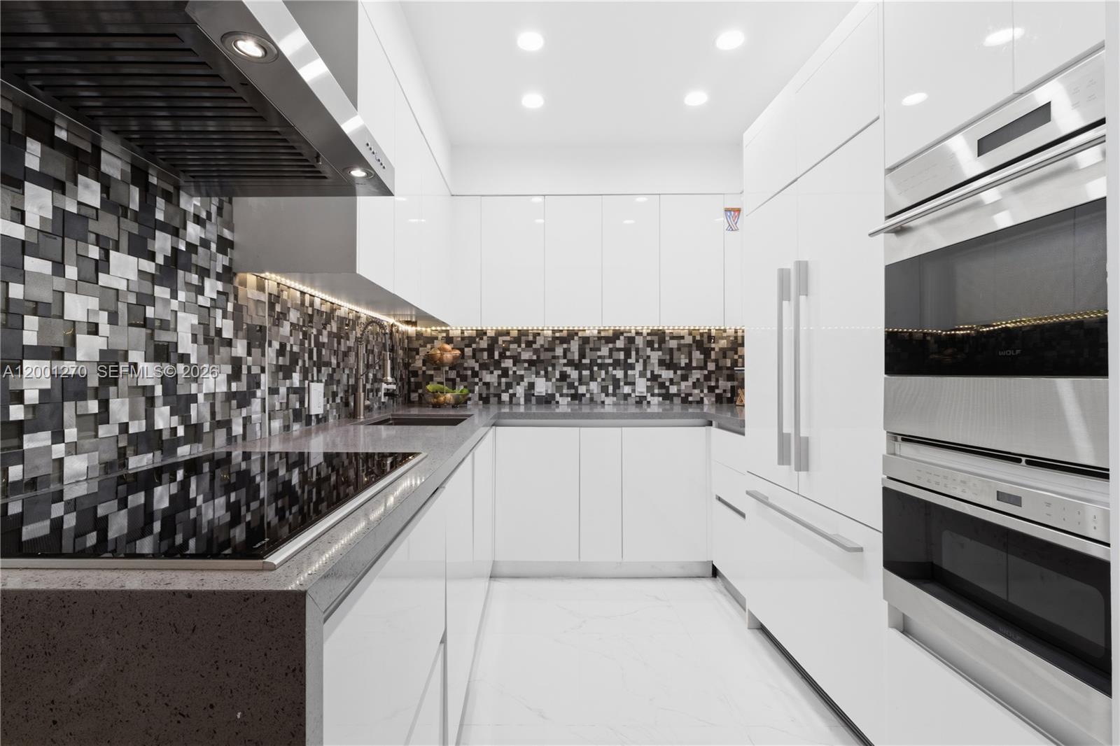 Photo of 20301 Country Club Dr  #PH24, Aventura, Florida, 33180 - Contemporary kitchen with custom cabinetry and premium appliances
