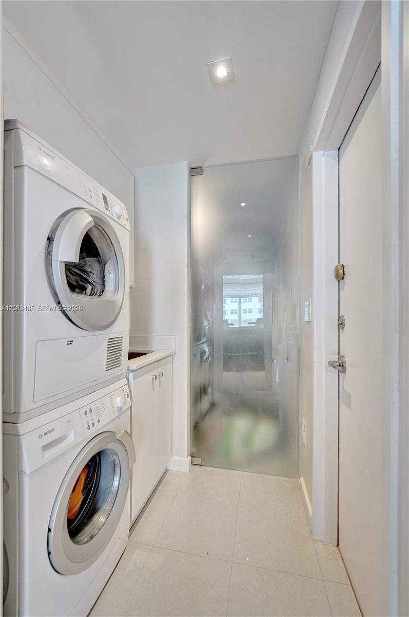 Photo of 2751 Ocean Dr  #908S, Hollywood, Florida, 33019 - Full Size Bosch Washer/Dryer laundry room with utility sink and Pantry