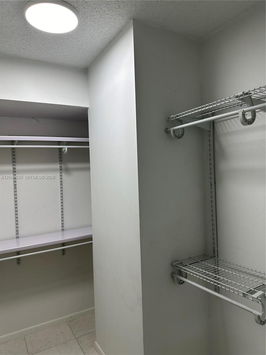 Photo of 600 Three Islands Blvd  #1113, Hallandale Beach, Florida, 33009 - Walk in closet with French organizer