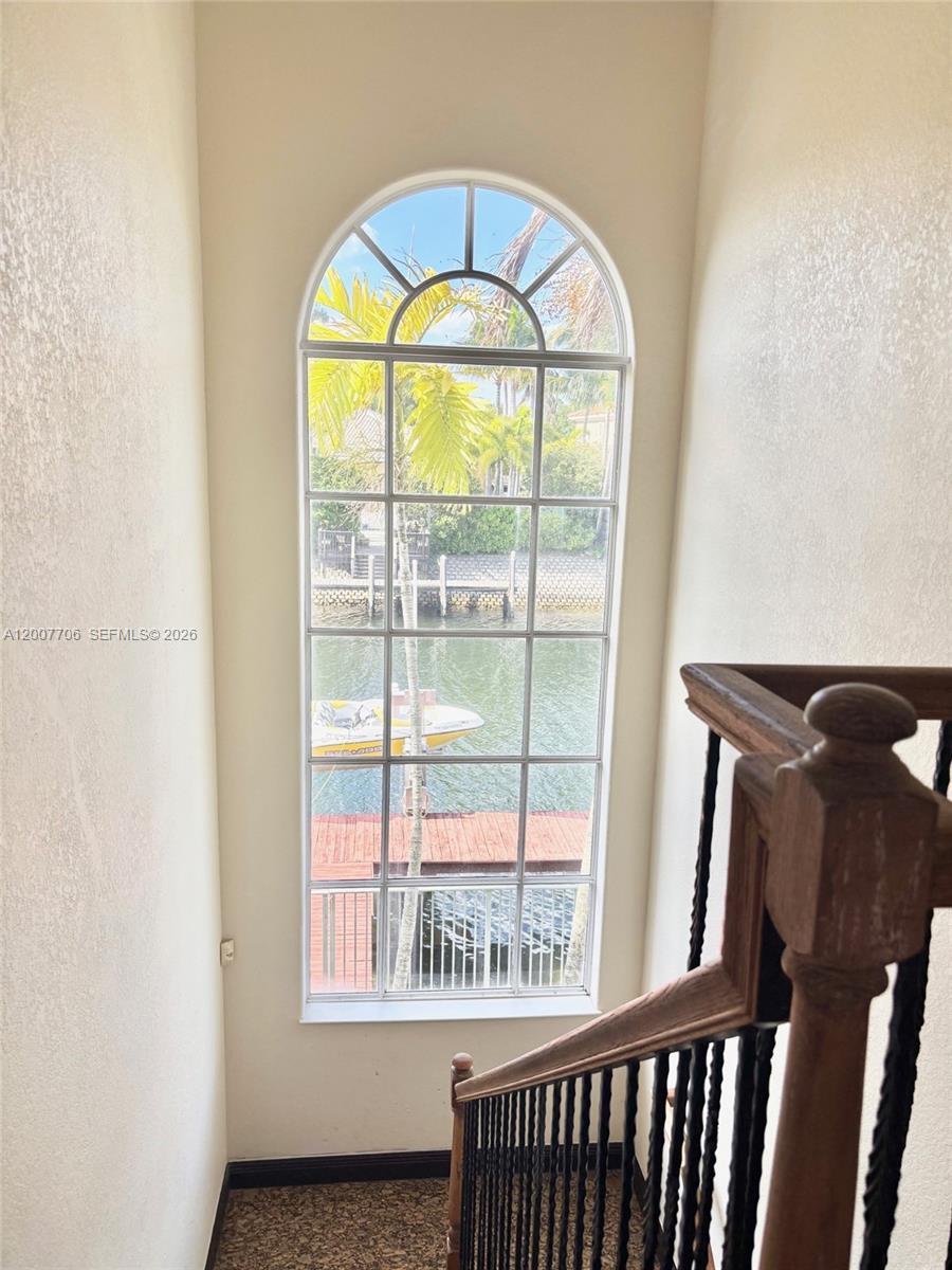 Photo of 1141 Waterside Ln  (1141), Hollywood, Florida, 33019 - Huge window by staircase overlooking the water.
