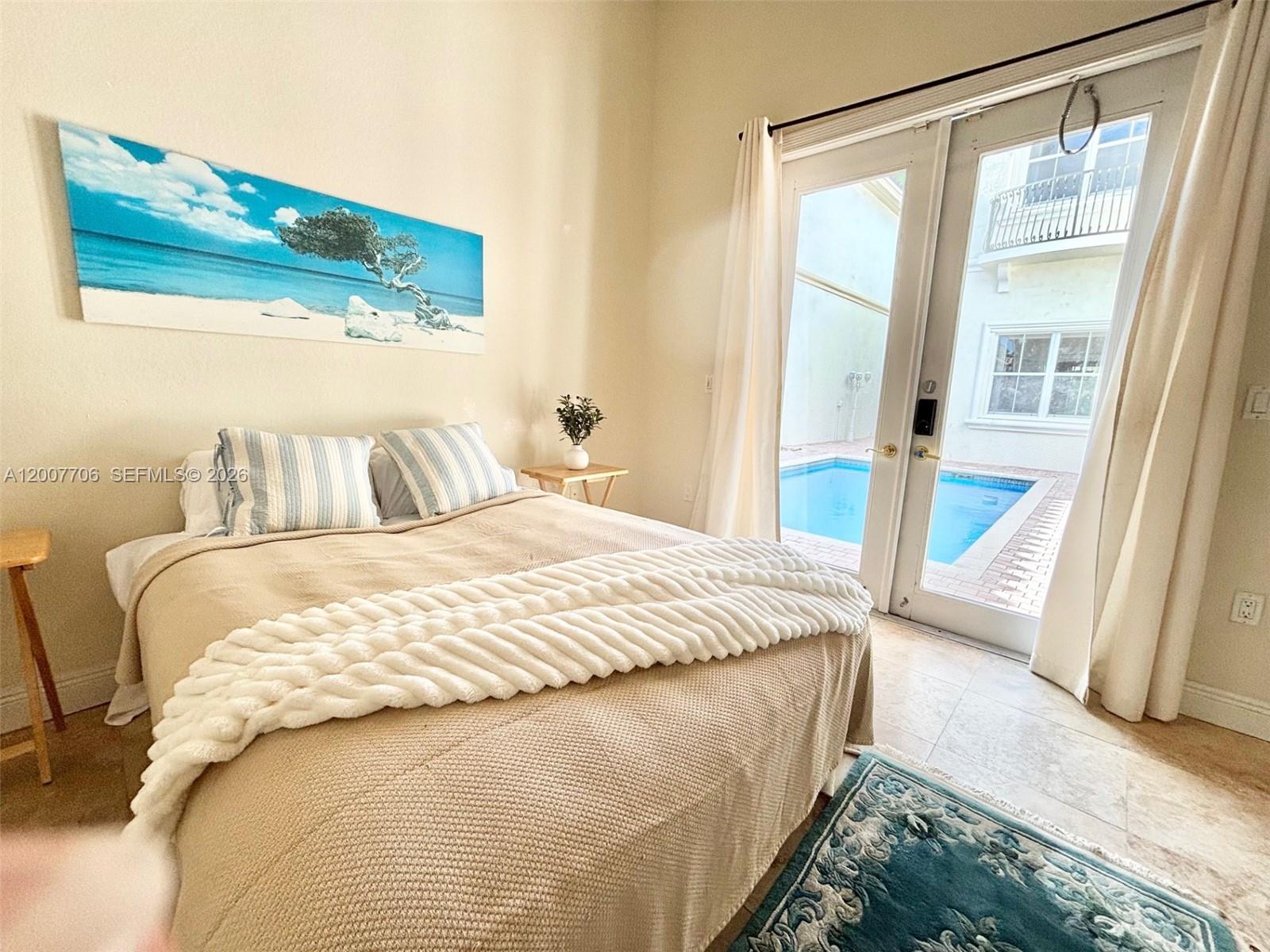 Photo of 1141 Waterside Ln  (1141), Hollywood, Florida, 33019 - Guest house bedroom overlooking the pool