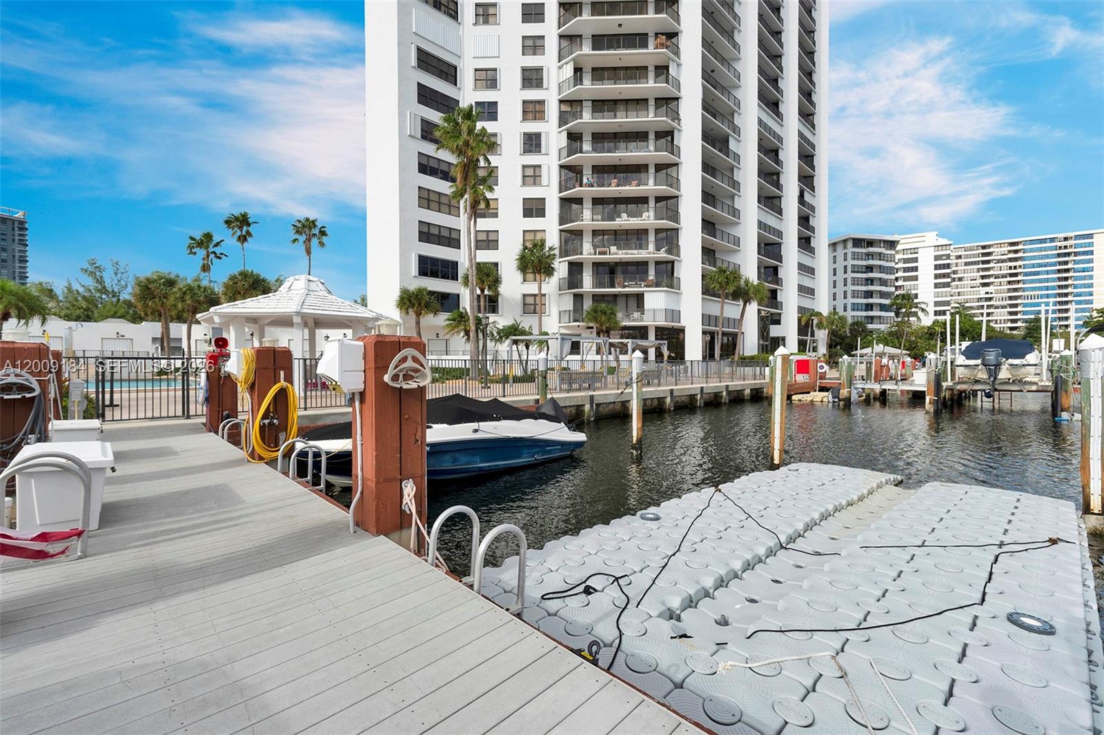 Photo of 300 Three Islands Blvd  #305, Hallandale Beach, Florida, 33009 - Dock and building exterior