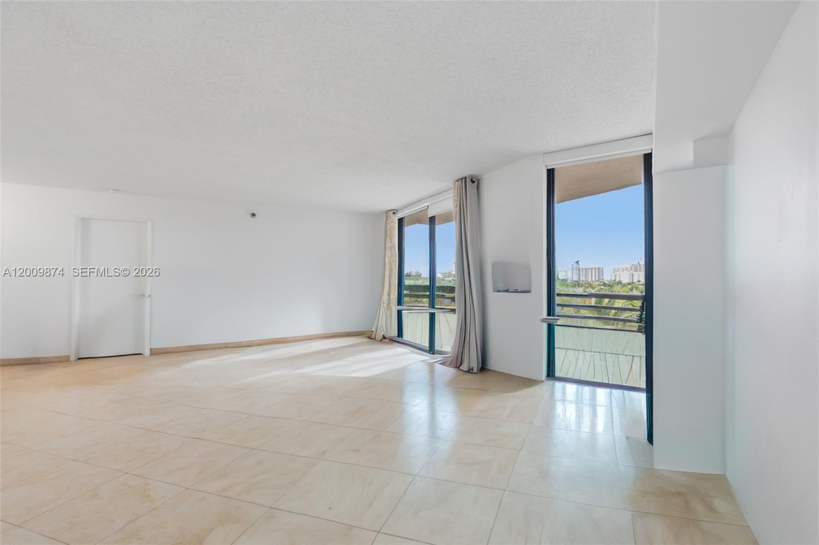 Photo of 3300 191st St #609, Aventura, Florida, 33180 - Living room & den/possible 2nd bd - photoshop