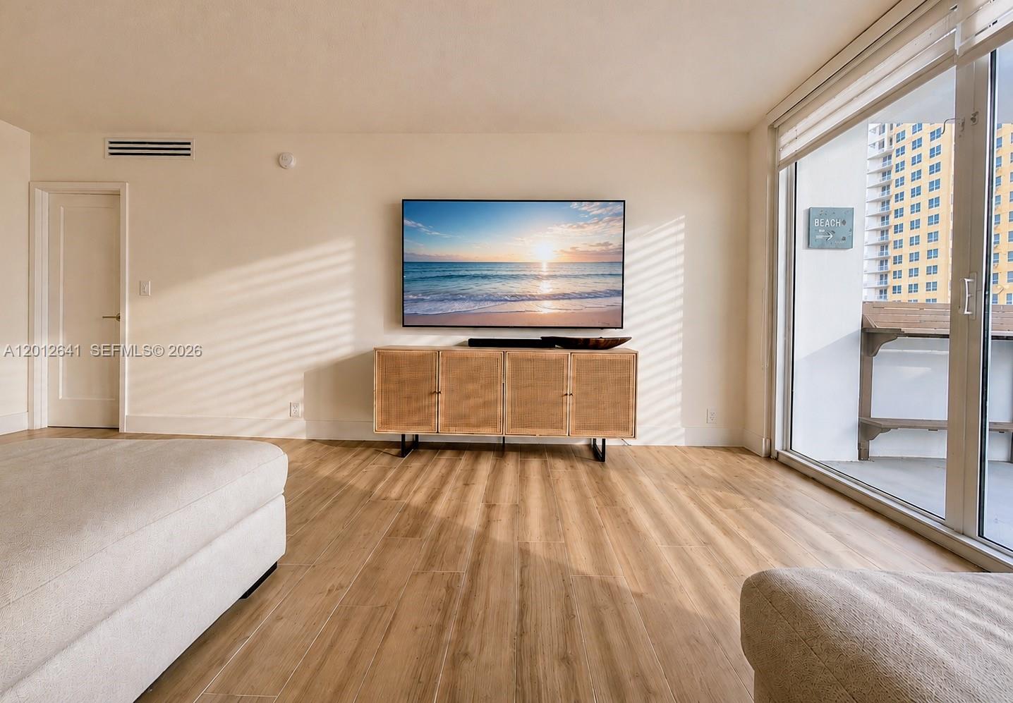 Photo of 2030 Ocean Dr  #309, Hallandale Beach, Florida, 33009 - LIVING ENTERTAINING AREA WITH EASY ACCESS OCEANVIEW TERRACE