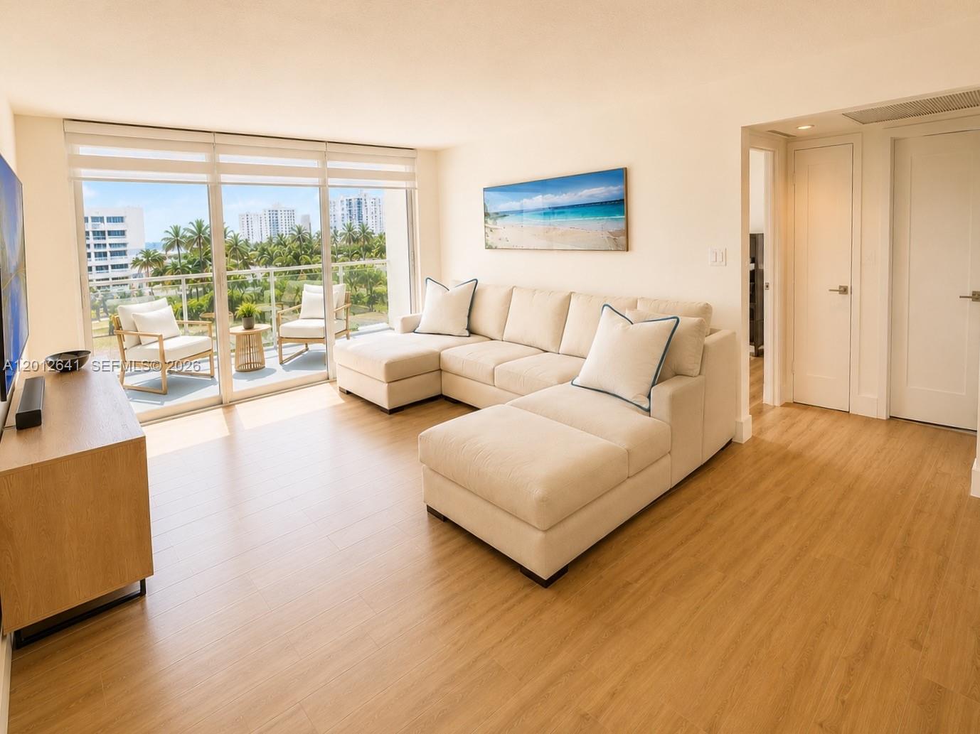 Photo of 2030 Ocean Dr  #309, Hallandale Beach, Florida, 33009 - SPACIOUS LIVING / DINING ROOM COMBINATION OFFERS CONTEMPORARY OPEN-FLOOR PLAN WITH EASY ACCESS OCEANSIDE TERRACE PERFECT FOR WARM BREEZES AND CONVERSATION.