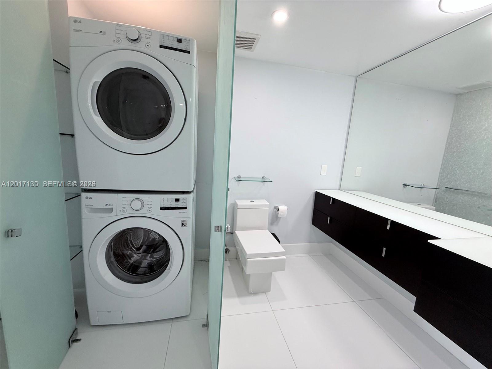 Photo of 19390 Collins Ave #907, Sunny Isles Beach, Florida, 33160 - Main bathroom w washer dryer