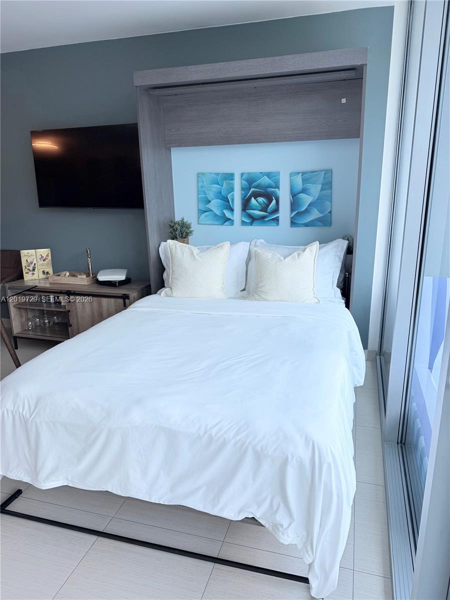 Photo of 2950 188th St #228, Aventura, Florida, 33180 - Queen-size Murphy bed in the living room